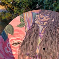 a painting of a woman with long hair